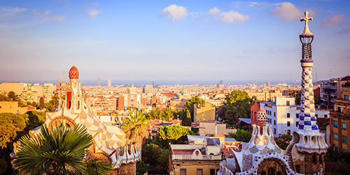 A captivating view of Barcelona and its artistic architecture with the sea on the horizon.